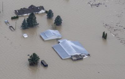 Flood waters surround a farm in Abbotsford, B.C., on November 23, 2021. (THE CANADIAN PRESS/Jonathan Hayward) 
