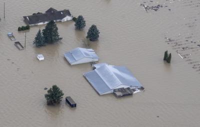 Flood waters surround a farm in Abbotsford, B.C., on November 23, 2021. (THE CANADIAN PRESS/Jonathan Hayward) Flood waters surround a farm in Abbotsford, B.C., on November 23, 2021. (THE CANADIAN PRESS/Jonathan Hayward)
