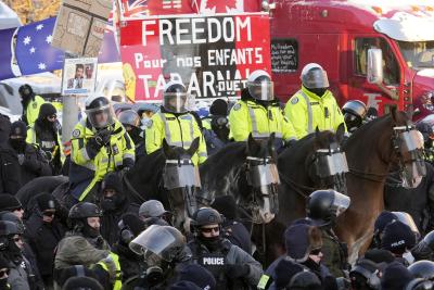 Toronto Police mounted unit officers stand by as police take action to put an end to the protests in Ottawa on February 18, 2022. (THE CANADIAN PRESS/Adrian Wyld)