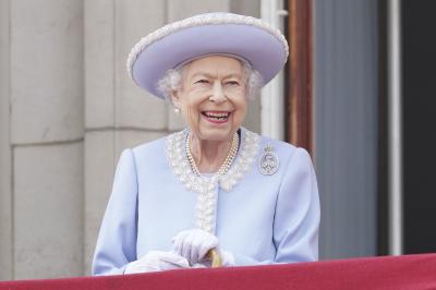 Queen Elizabeth II smiles from the balcony of Buckingham Palace on June 2, 2022, on the first of four days of celebrations to mark the Platinum Jubilee celebrating the monarch’s 70 years of service. (Jonathan Brady/Pool Photo via AP) 