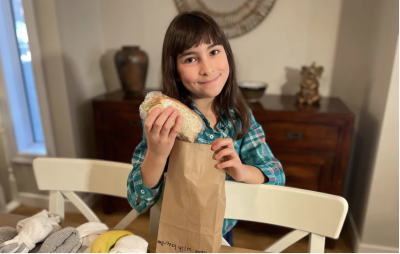 Grace Kennedy assembling her care packages. Grace Kennedy assembling her care packages.