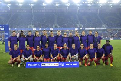 CANWNT players wear purple shirts with "Enough is Enough" written on them while posing for the team photo before a SheBelieves Cup soccer match against the United States on February 16, 2023 in Orlando, Florida. (AP Photo/Phelan M. Ebenhack) 