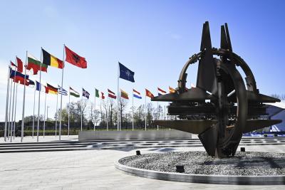 A sculpture and flags outside the NATO headquarters in Brussels, Belgium on April 4, 2023. Finland became the 31st member state of the North Atlantic Treaty Organization the same day. (LEHTIKUVA / EMMI KORHONEN)