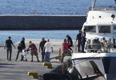 A child escorted by coast guard officers disembarks with other migrants from a vessel after a rescue operation, at the port of Mytilene, on the northeastern Aegean Sea island of Lesbos, Greece, on August 28, 2023. (AP Photo/Panagiotis Balaskas) A child escorted by coast guard officers disembarks with other migrants from a vessel after a rescue operation, at the port of Mytilene, on the northeastern Aegean Sea island of Lesbos, Greece, on August 28, 2023. (AP Photo/Panagiotis Balaskas)