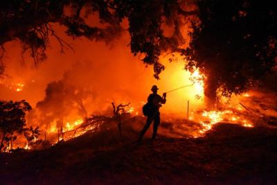 Firefighters battle devastating fires in southern California. (Photo via California Wildfire’s Facebook page.) Firefighters battle devastating fires in southern California. (Photo via California Wildfire’s Facebook page.)
