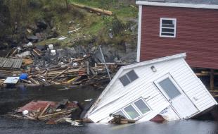 Buildings sit in the water along the shore following hurricane Fiona in Rose Blanche-Harbour Le Cou, Newfoundland on September 27, 2022. (THE CANADIAN PRESS/Frank Gunn)