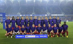 CANWNT players wear purple shirts with "Enough is Enough" written on them while posing for the team photo before a SheBelieves Cup soccer match against the United States on February 16, 2023 in Orlando, Florida. (AP Photo/Phelan M. Ebenhack) 