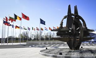 A sculpture and flags outside the NATO headquarters in Brussels, Belgium on April 4, 2023. Finland became the 31st member state of the North Atlantic Treaty Organization the same day. (LEHTIKUVA / EMMI KORHONEN)