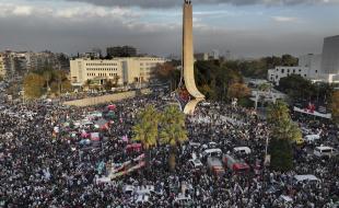Thousands of Syrians celebrate the ousting of Bashar al-Assad's government in Damascus, Syria. (AP Photo/Hussein Malla)