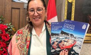Minister of Indigenous Affairs Mandy Gull Masty holds a copy of the 2025 federal budget. (Photo via X.)